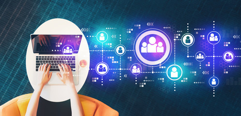 Social connections with person using a laptop on a white table