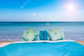 Bed with pillow in the nature happy summer holiday at the tropical sea