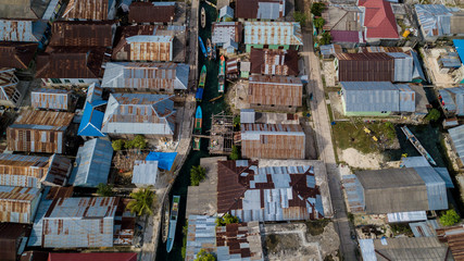 Aerial view or bird view of village with many wooden boats are docking