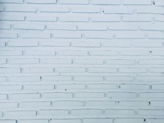 distressed white brick wall