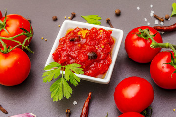 Tomato confiture, jam, chutney, sauce. Homemade preservation concept