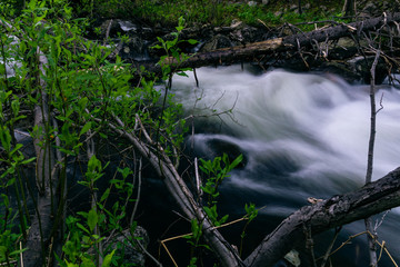 The rapids of the northern river in the night taiga