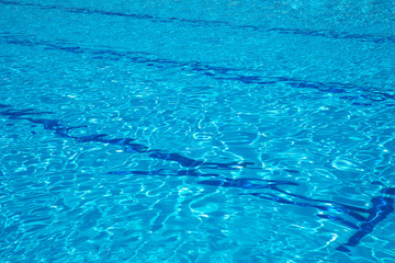 Swimming pool texture surface pattern background. Blue or Aqua color swimming pool water.