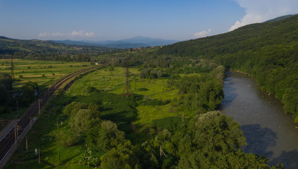 Aerial view of the Carpathian mountains. Natural background with geometric pattern - beige and red...