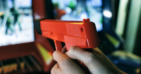Arcade: Close Up Of Woman Playing Shooting Game