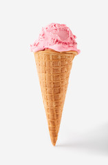 pink ice cream ball in a Waffle Cone on a white Background. Fruit ice cream in a waffle cone.