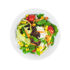 Healthy vegetables green caesar or greek mediterranean salad in white porcelain dish or plate for vegetarian on isolated white background from top view.