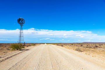 Windpump next to the gravel road in the Karoo