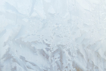 Fototapeta premium Frosty patterns on a frozen ice box in the early morning