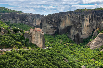 Secluded Greek monastery on top of rock cliff v6