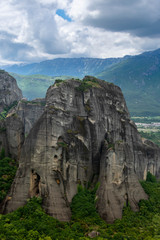 Rock cliff with mountains in background