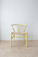 Minimalist architect designer concept with green classic chair on wooden floor with white wall background.