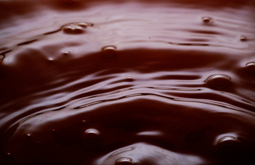 liquid chocolate with bubbles and ripples