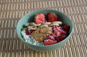Cottage cheese with peanut butter, coconut, strawberries and bananas