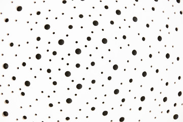 White surface with black holes