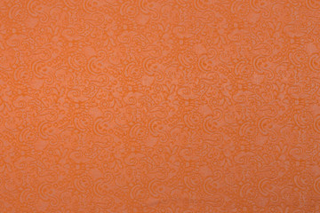 Creative orange fabric with floral pattern  and textile texture background