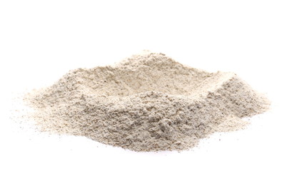 Integral rye flour pile isolated on white background
