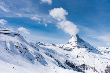 Fototapeta na wymiar The famous mountain Matterhorn peak with cloudy and blue sky from Gornergrat, Zermatt, Switzerland