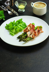 Asparagus in bacon, delicious grilled vegetables with meat wrapped. food background. top view