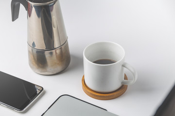 close up of smartphone and coffee cup . business and workplace concept . isolated freelancer tools