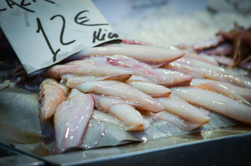 fresh seafood within the fish market in Spain - octopus, shells, shrimps, fish, oysters, lobster 