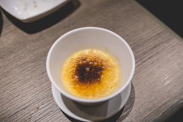 caramelised creme brulee served after lunch