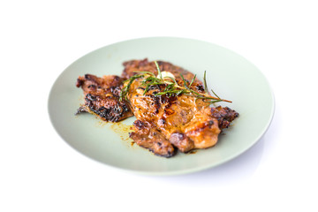 grilled beef steak and rosemary isolated on white background