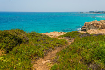  Panoramic view of Ayia Napa coast, Cyprus with blue sea and yellow-black rocks
