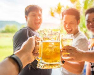 Group of happy friends drinking  beer at outdoor, Happy friendship concept