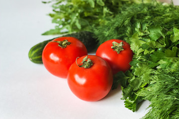 Isolated Vegetables on White Background: Tomatoes, Cucumber and Greens
