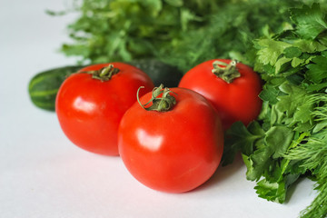 Isolated Vegetables on White Background: Tomatoes, Cucumber and Greens