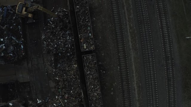 Metal recycle factory, Magnetic Backhoe use electromagnets crane keeping metal.color vintage style.Aerial view
