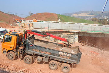 Truck by a Road bridge under construction