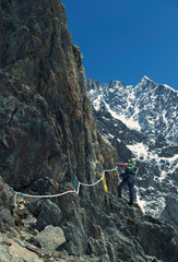 Obraz premium Hiker traveling in Alps. Alpine peaks landskape background. Jungfrau, Bernese highland. Sport, tourism and hiking concept.