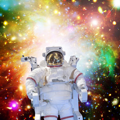 Astronaut and space, galaxies and stars. The elements of this image furnished by NASA.