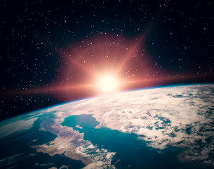 Sunflare and the earth from space. The elements of this image furnished by NASA.