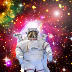 Astronaut and space, galaxies and stars. The elements of this image furnished by NASA.