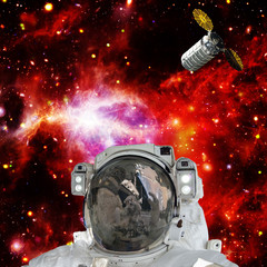 Astronaut posing against galaxies and stars. Outer space. The elements of this image furnished by...