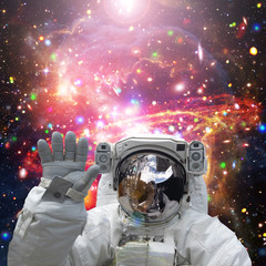 Obraz na płótnie Canvas Astronaut waves. The elements of this image furnished by NASA.