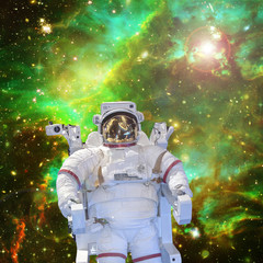 Obraz na płótnie Canvas Astronaut and space, galaxies and stars. The elements of this image furnished by NASA.