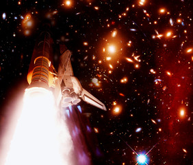 Rocket and galaxies with stars. The elements of this image furnished by NASA.