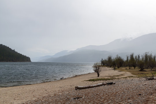 Storm approaches Shuswap Lake shoreline in British Columbia, Canada