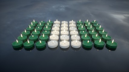 Candles with the colors of the Nigerian flag. In memory of the victims.