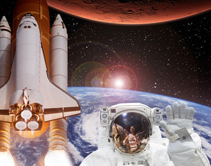 Rocket flies from earth to Mars. Astronaut waving in space. The elements of this image furnished by...