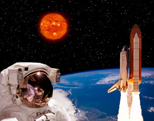 Astronaut staring on the rocket that flying from earth. Big sun against stars. The elements of this image furnished by NASA.