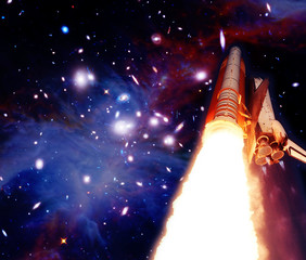 Big rocket against stars, planets and galaxies. The elements of this image furnished by NASA.