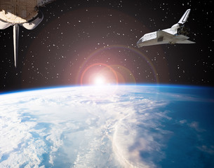 Shuttle flies in space. Other spaceship goes anywhere.  The elements of this image furnished by...
