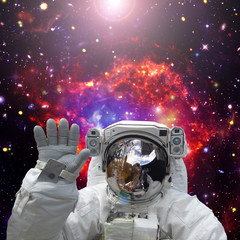 Astronaut waves. The elements of this image furnished by NASA.