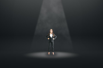 Businesswoman in black spotlight