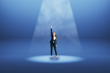 Businesswoman in blue spotlight